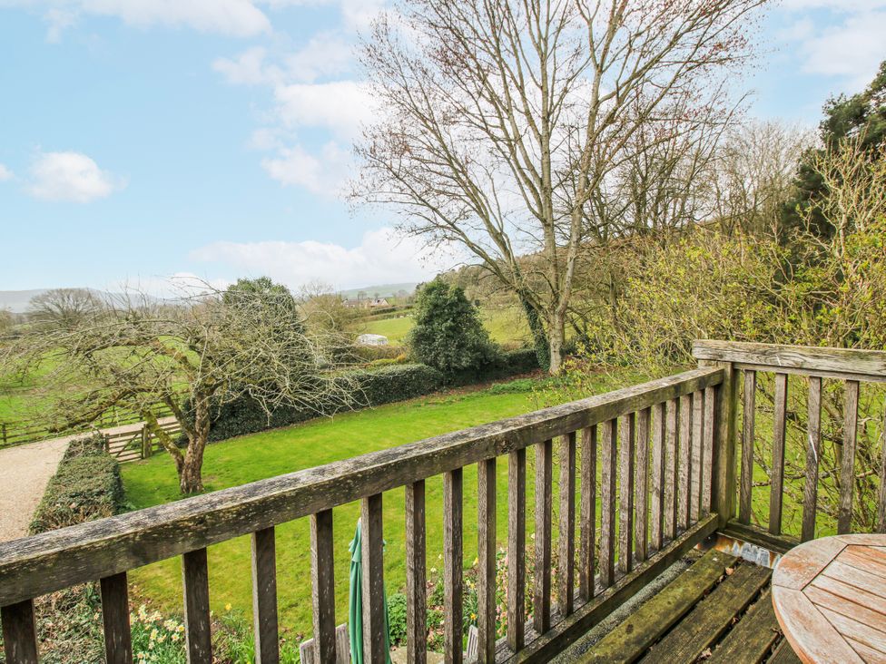 A view from a balcony overlooking a garden at Bell House Cottage in Wistanstow near Craven Arms