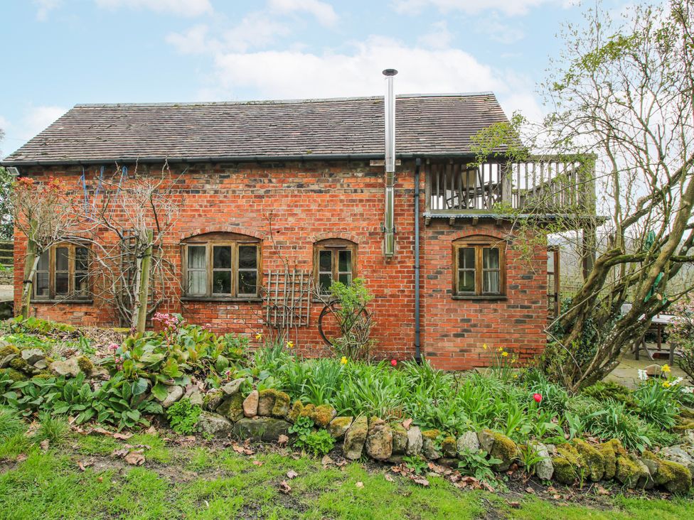 A brick house with garden and balcony at Bell House Cottage Wistanstow near Craven Arms