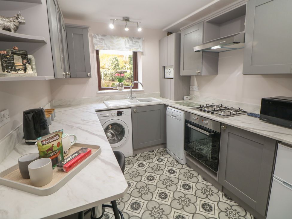 A kitchen with appliances and a worktop at Wayside Cottage at Wayside Farm Matlock