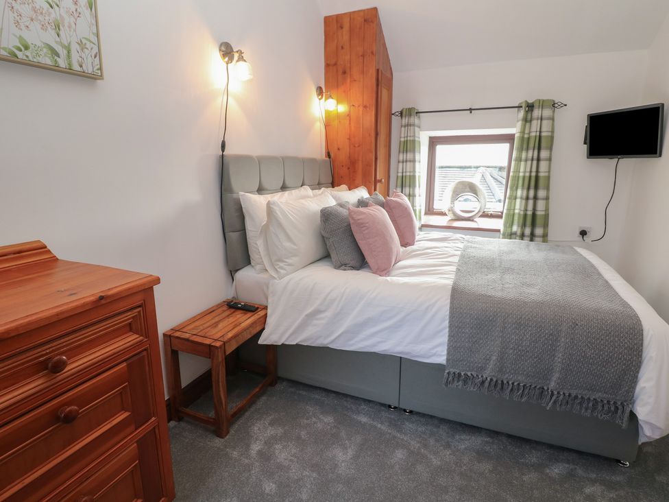 A bedroom with a bed and a window at Wayside Cottage at Wayside Farm Matlock