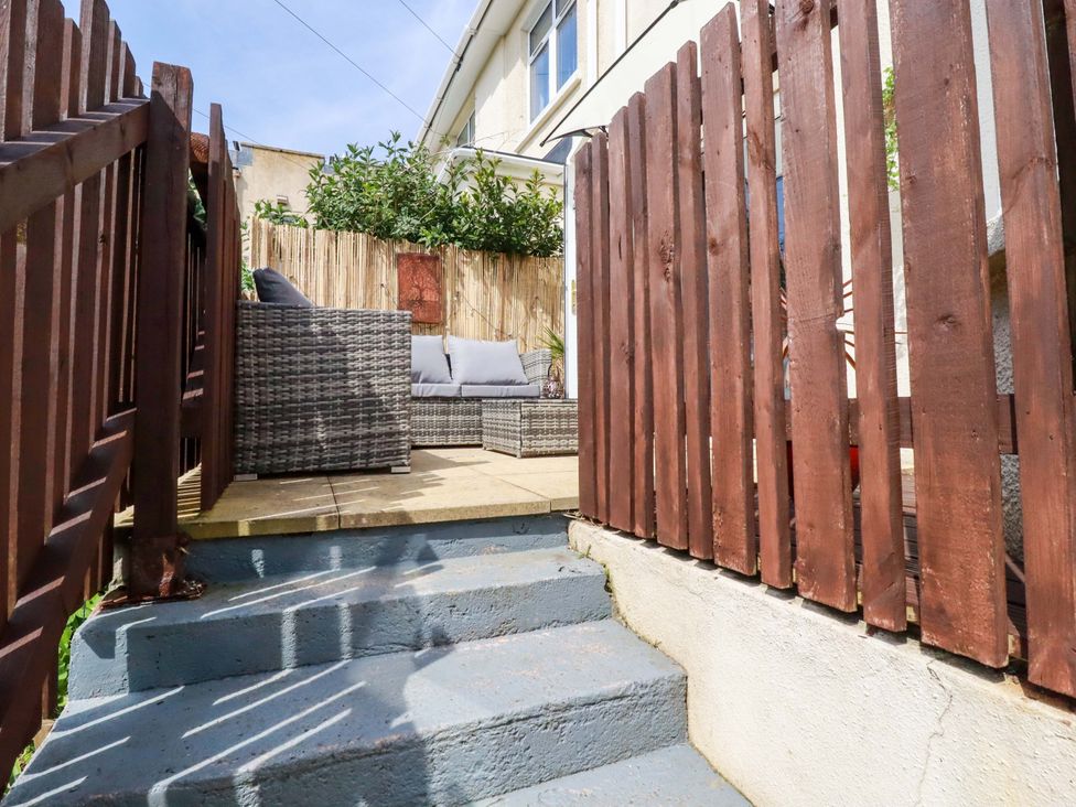 An outdoor area with steps leading to seating at Tolcarne Reach in Newquay