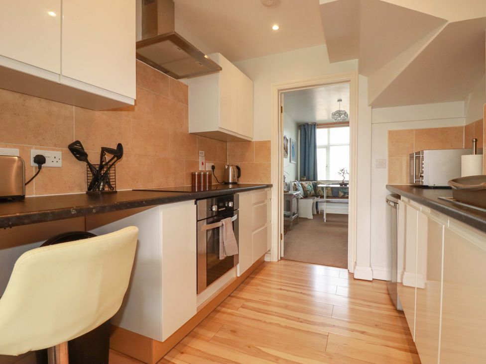 A kitchen with a countertop and appliances at Tolcarne Reach in Newquay