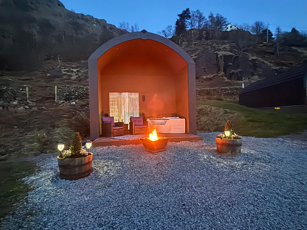 An outdoor area with a fire pit and seating at Bluebelle - Crossgate Luxury Glamping in Hartsop