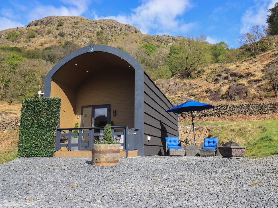 An outdoor cabin with a deck and seating area at Bluebelle - Crossgate Luxury Glamping Hartsop