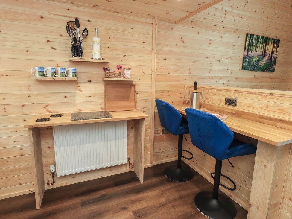 A kitchen area with mugs and counter space at Bluebelle - Crossgate Luxury Glamping Hartsop