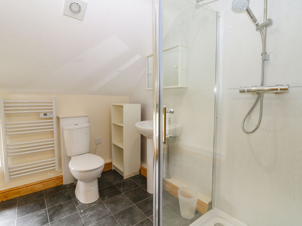 A bathroom with a shower and sink at Lavender Lodge in Hull