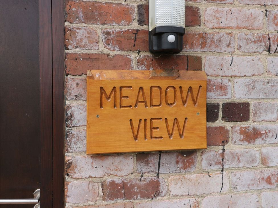 A sign on a brick wall at Meadow View in Hull