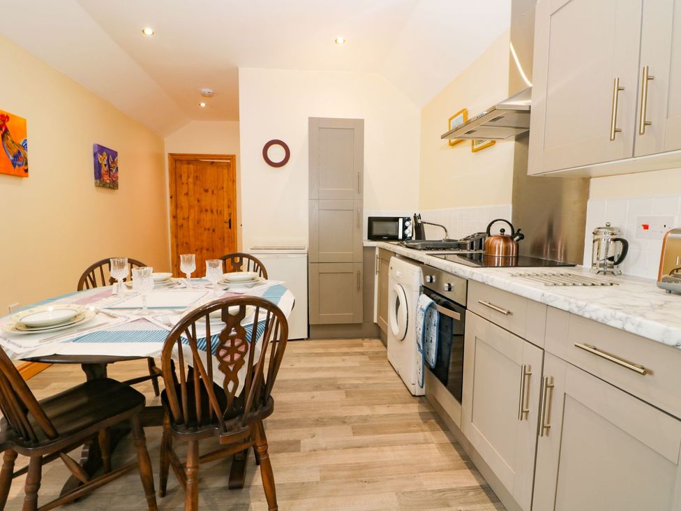 A kitchen with dining table and appliances at Meadow View in Hull