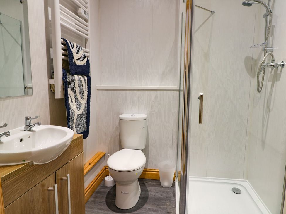 A bathroom with a sink and shower at Meadow View in Hull
