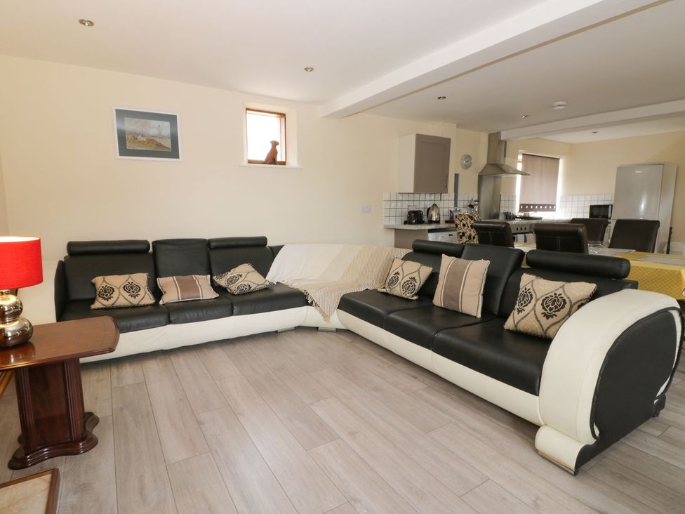 A living room with a sofa and window at Mulberry Manor in Hull