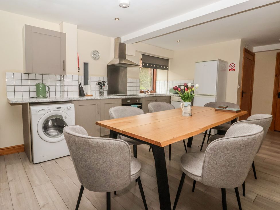 A kitchen with dining table and chairs at Mulberry Manor in Tunstall near Withernsea