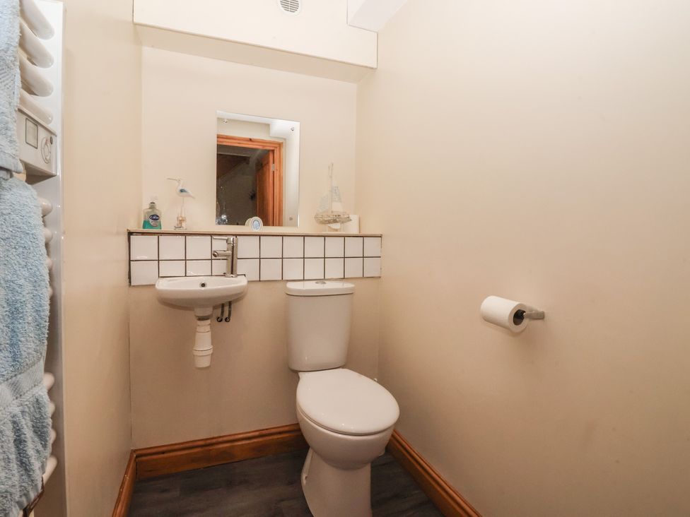 A bathroom with a sink and toilet at Mulberry Manor in Tunstall near Withernsea