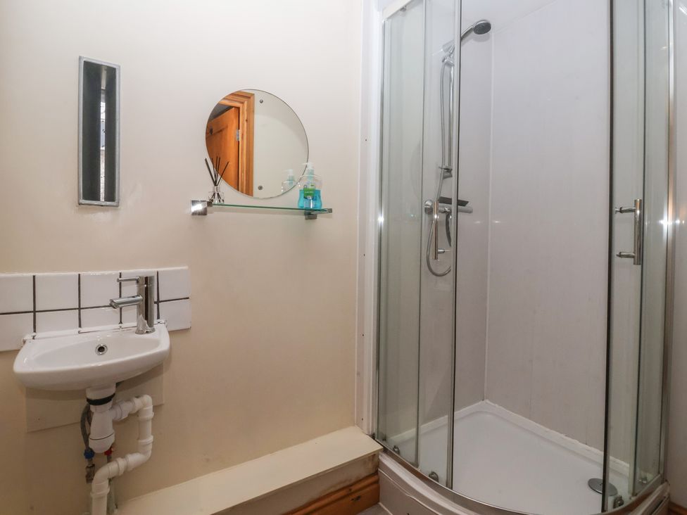 A bathroom with a shower and a sink at Mulberry Manor in Tunstall near Withernsea