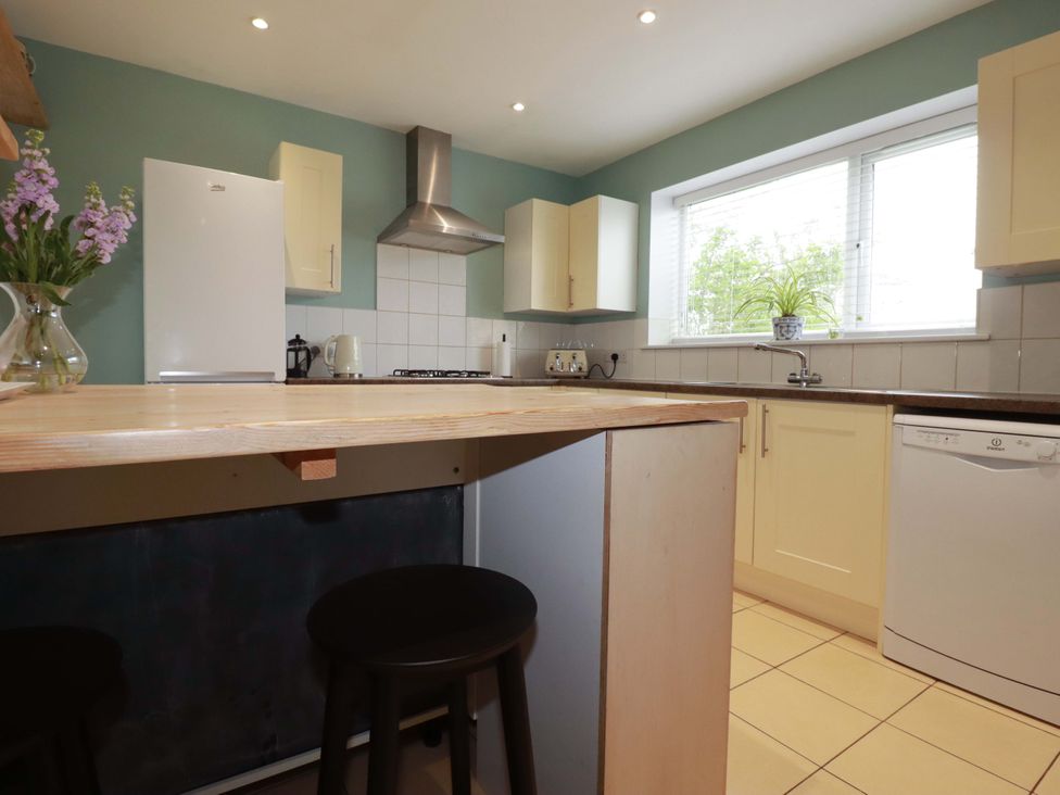 A kitchen with appliances and a counter at Trelowen in Trenance