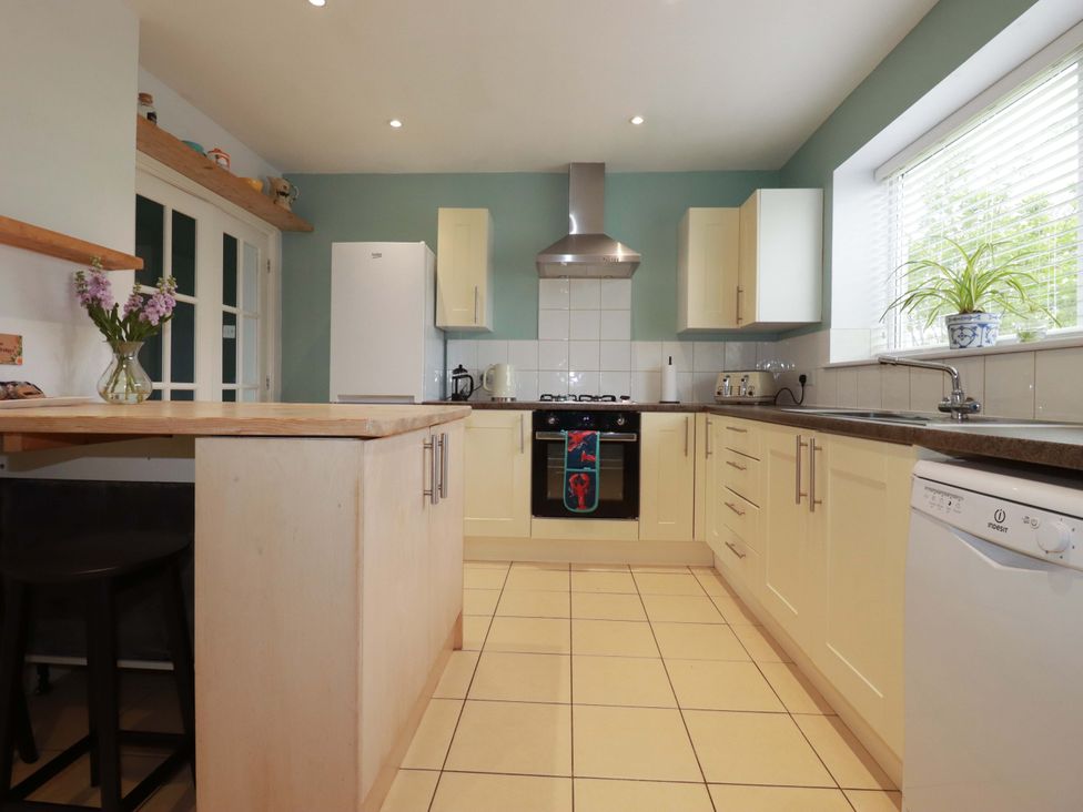 A kitchen with counters and appliances at Trelowen in Trenance