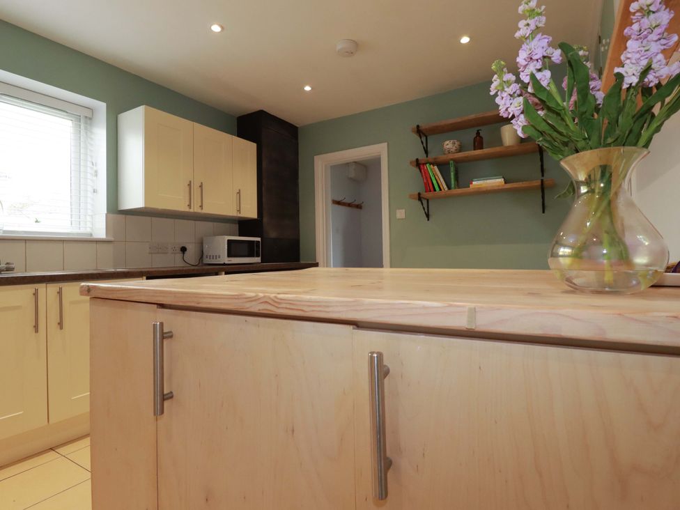 A kitchen with cabinets and a countertop at Trelowen in Trenance