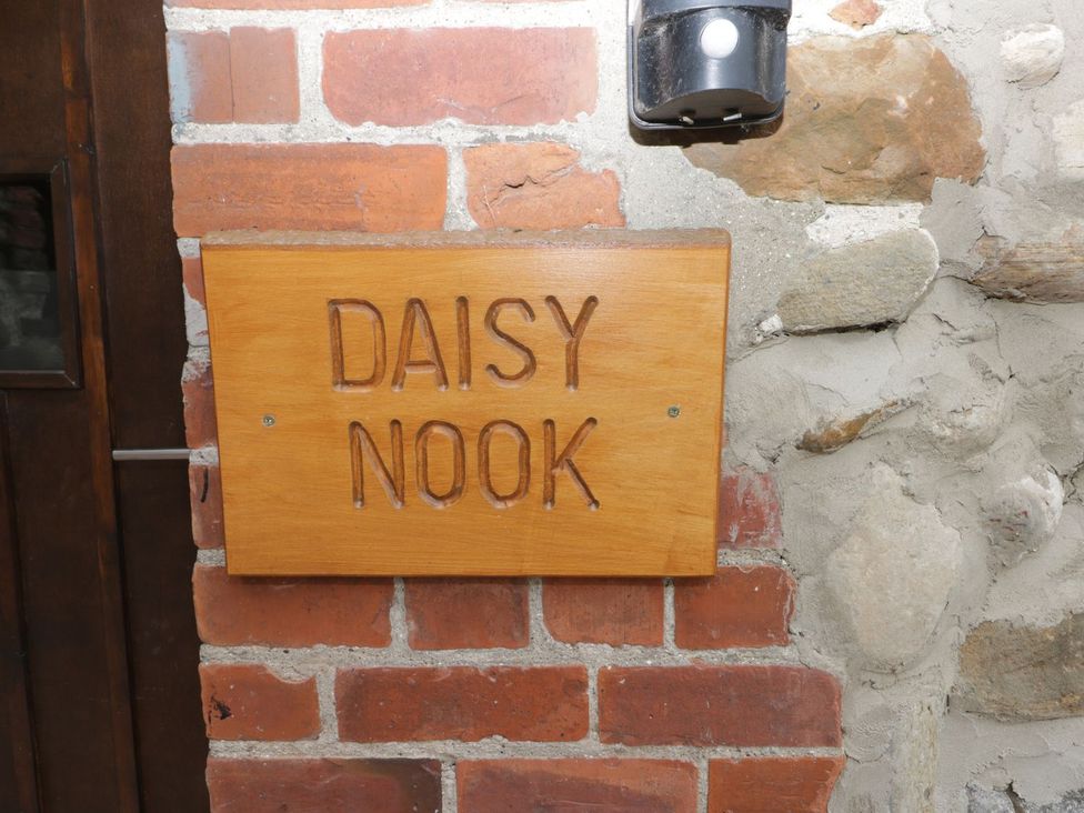 A wooden sign reading DAISY NOOK at the entrance of Daisy Nook in Hull