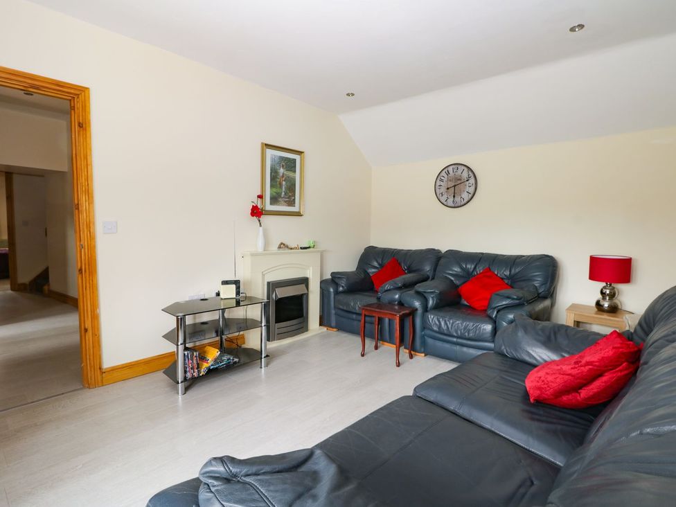 A living room with a sofa and coffee table at Daisy Nook in Hull