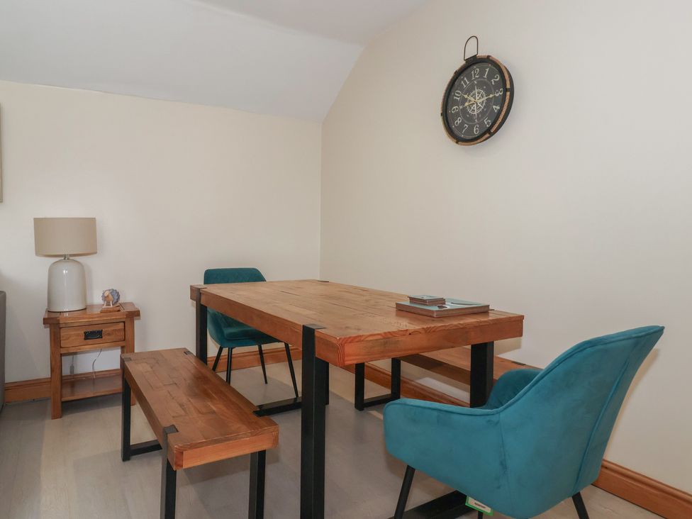 A dining room with a table and chairs at Daisy Nook in Withernsea