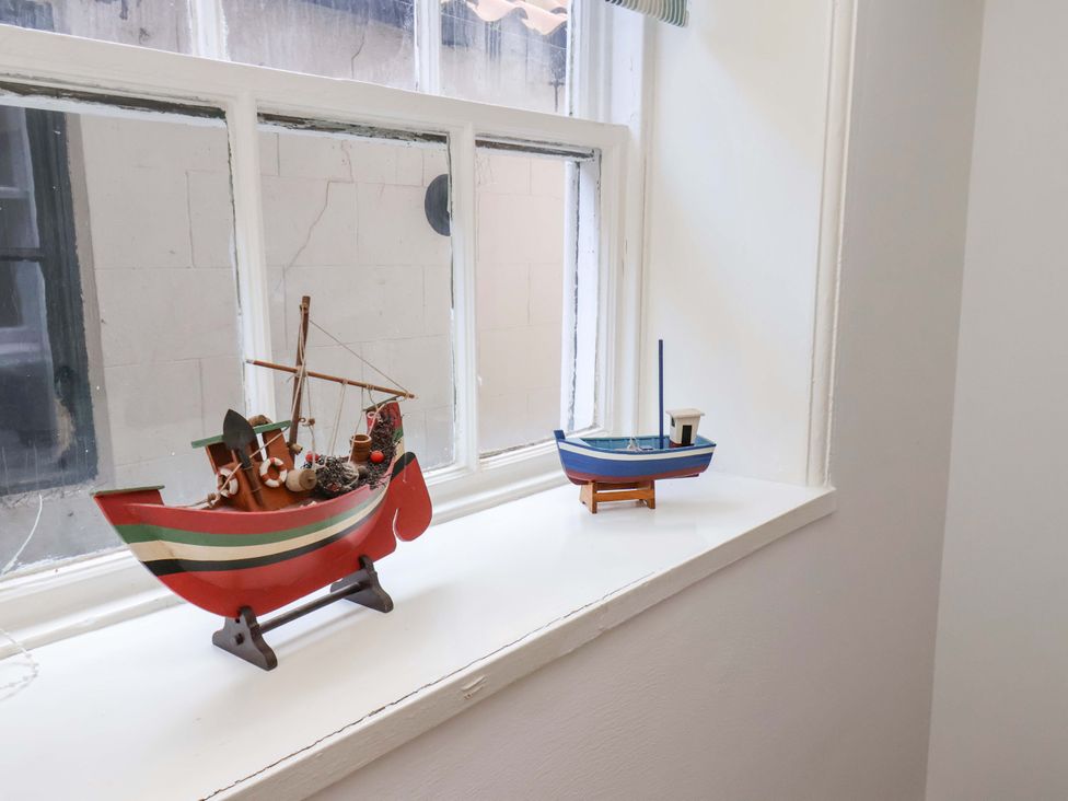 Two decorative boats on a windowsill at The Four Views in Whitby