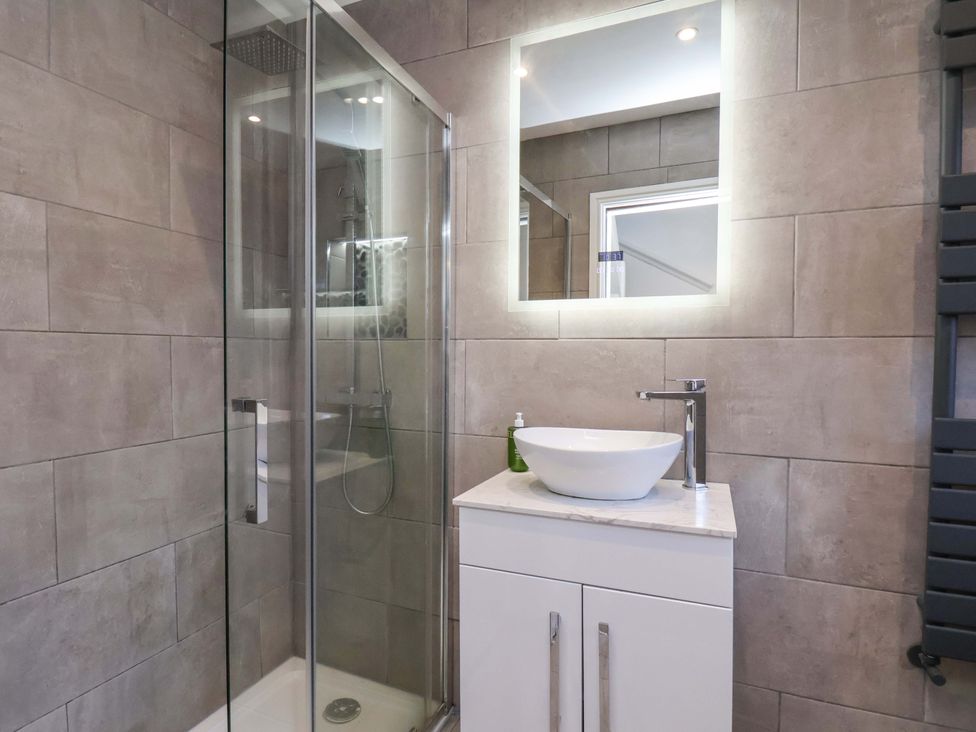 A bathroom with a shower and sink at The Four Views in Whitby