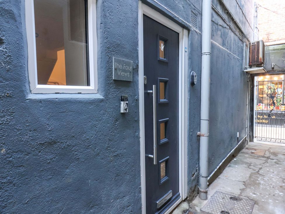 An entrance door and window with plaque at The Four Views in Whitby