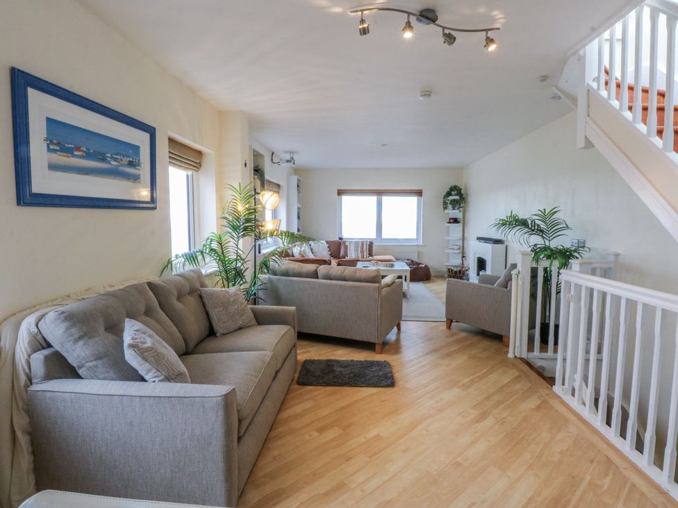 A living room with sofas and a coffee table at Snowdonia View in Pwllheli
