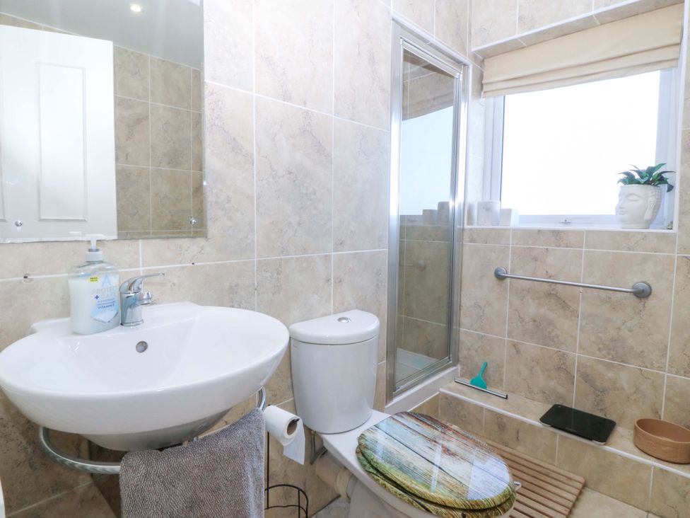 A bathroom with a sink and shower at Snowdonia View in Pwllheli