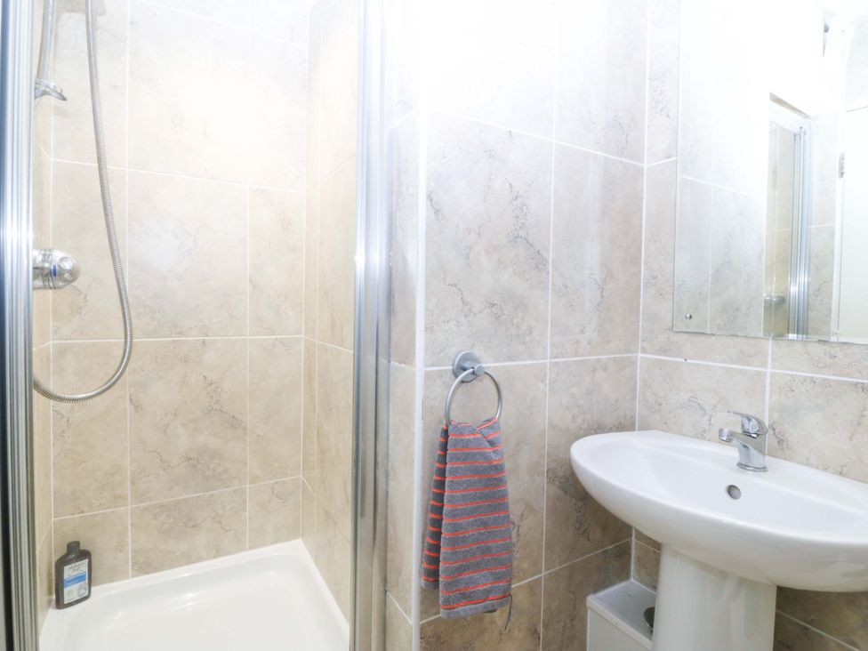 A bathroom with a shower and sink at Snowdonia View in Pwllheli