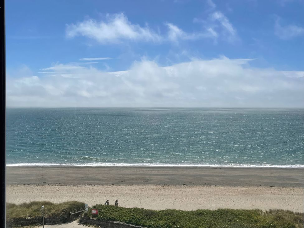 A view of the beach with sea and sky at Snowdonia View in Pwllheli