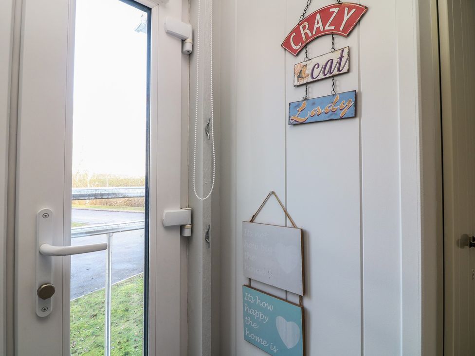 An entrance with signs on the wall at Fairways 22 Lincoln