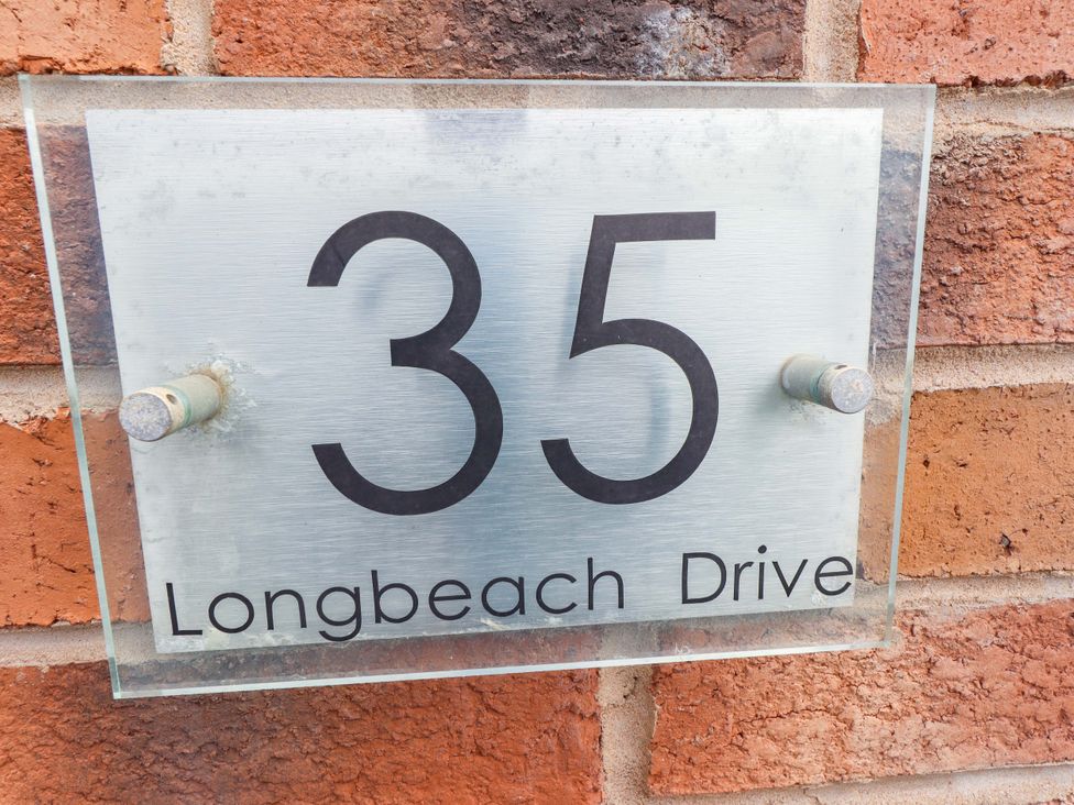 A house number sign displaying 35 Longbeach Drive