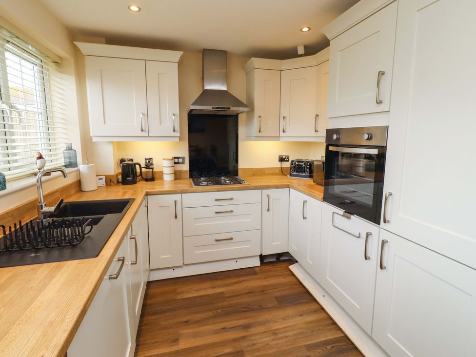 A kitchen with cabinets and appliances at 35 Longbeach Drive