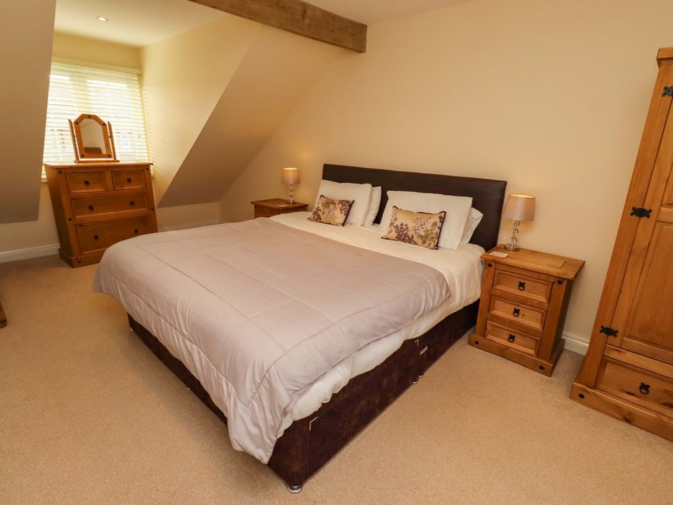 A bedroom with a bed and furniture at 35 Longbeach Drive