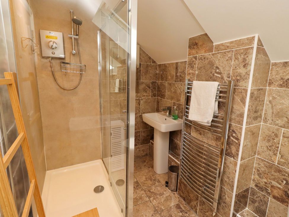 A bathroom featuring a shower and sink at 35 Longbeach Drive