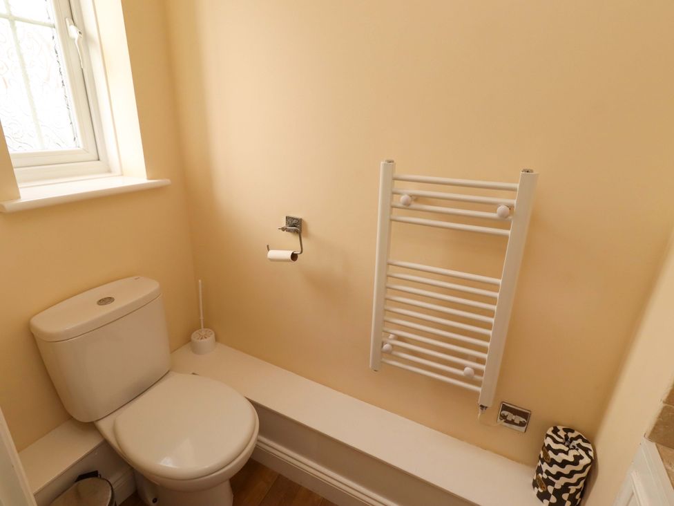 A bathroom with a toilet and towel rail at 35 Longbeach Drive