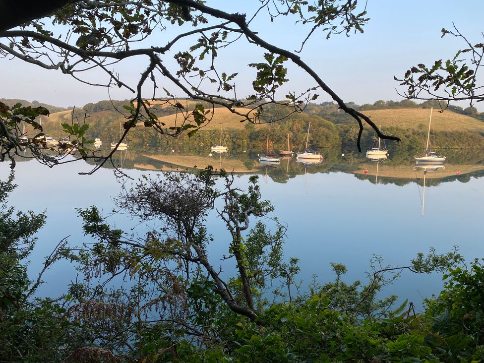 A view of boats on water with reflections at The Cowshed in Portscatho