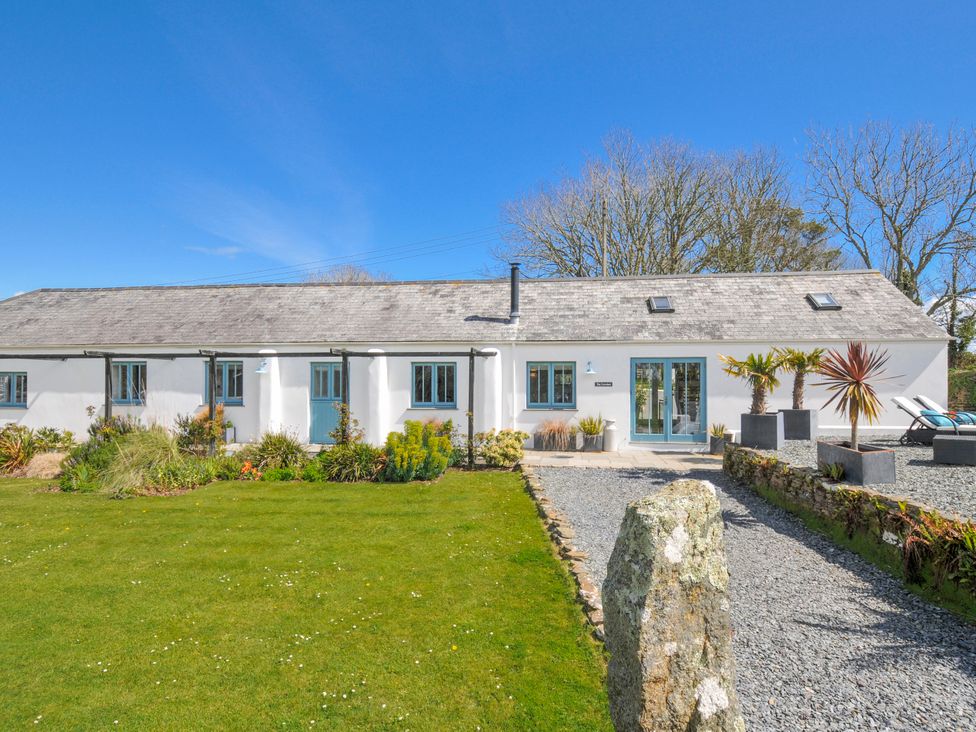 A house with a garden and pathway at The Cowshed in Portscatho
