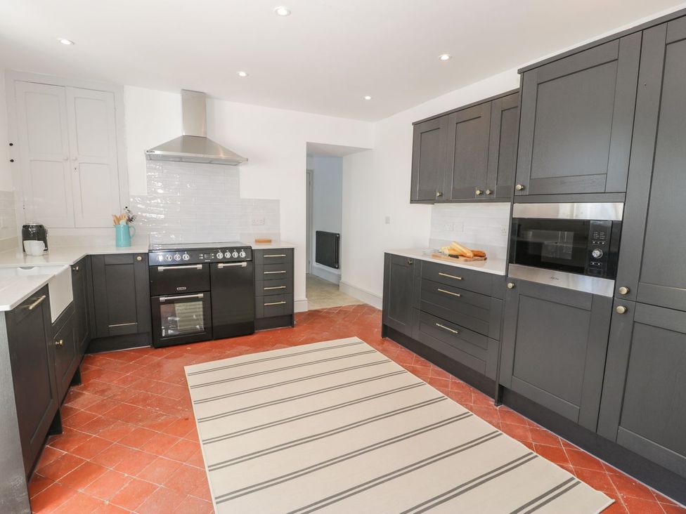 A kitchen with cabinets and appliances at Ty Mawr Farm in Llanfairpwllgwyngyll