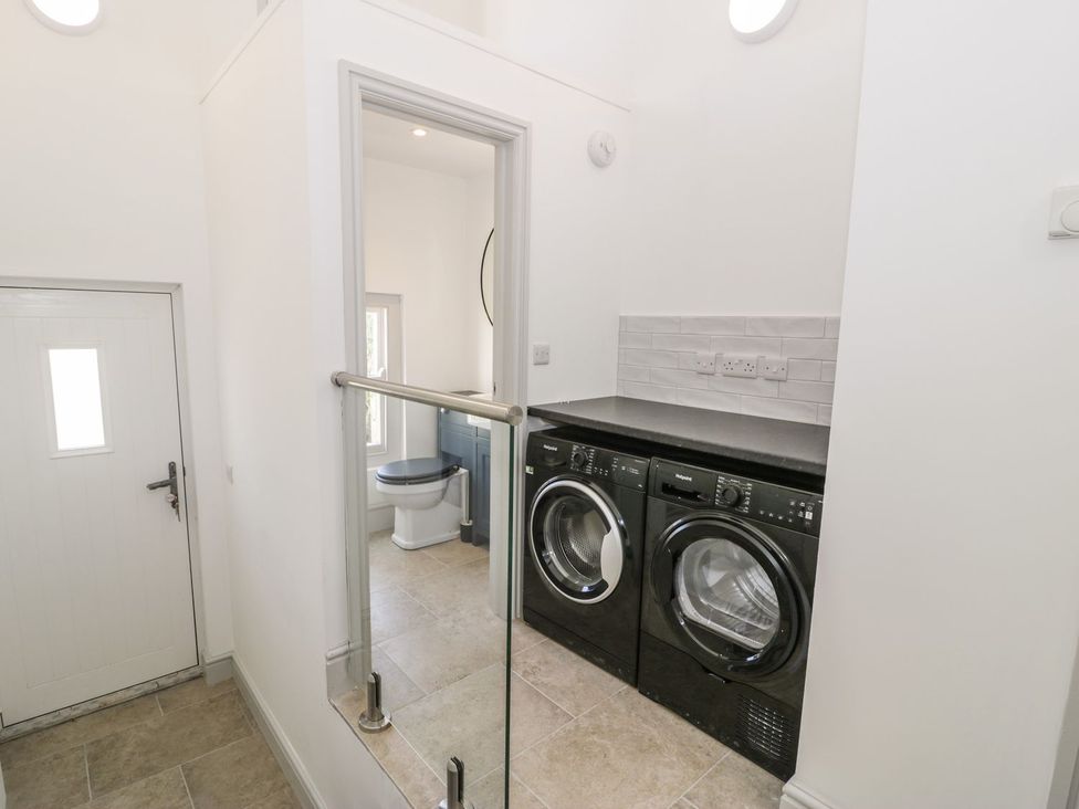 A laundry room with a washing machine and dryer at Ty Mawr Farm Llanfairpwllgwyngyll