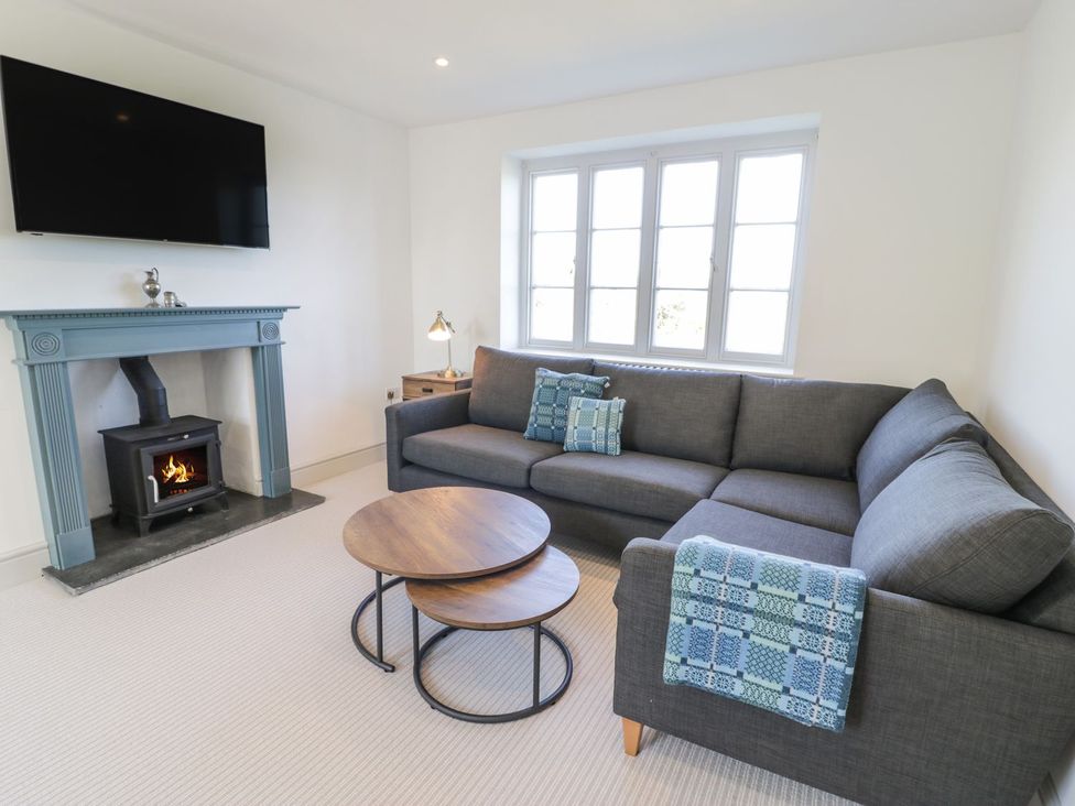 A living room with a sofa and coffee table at Ty Mawr Farm in Llanfairpwllgwyngyll