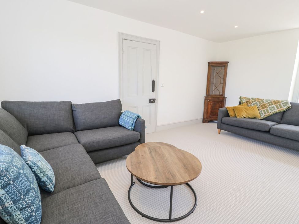 A living room with a sofa and side table at Ty Mawr Farm in Llanfairpwllgwyngyll