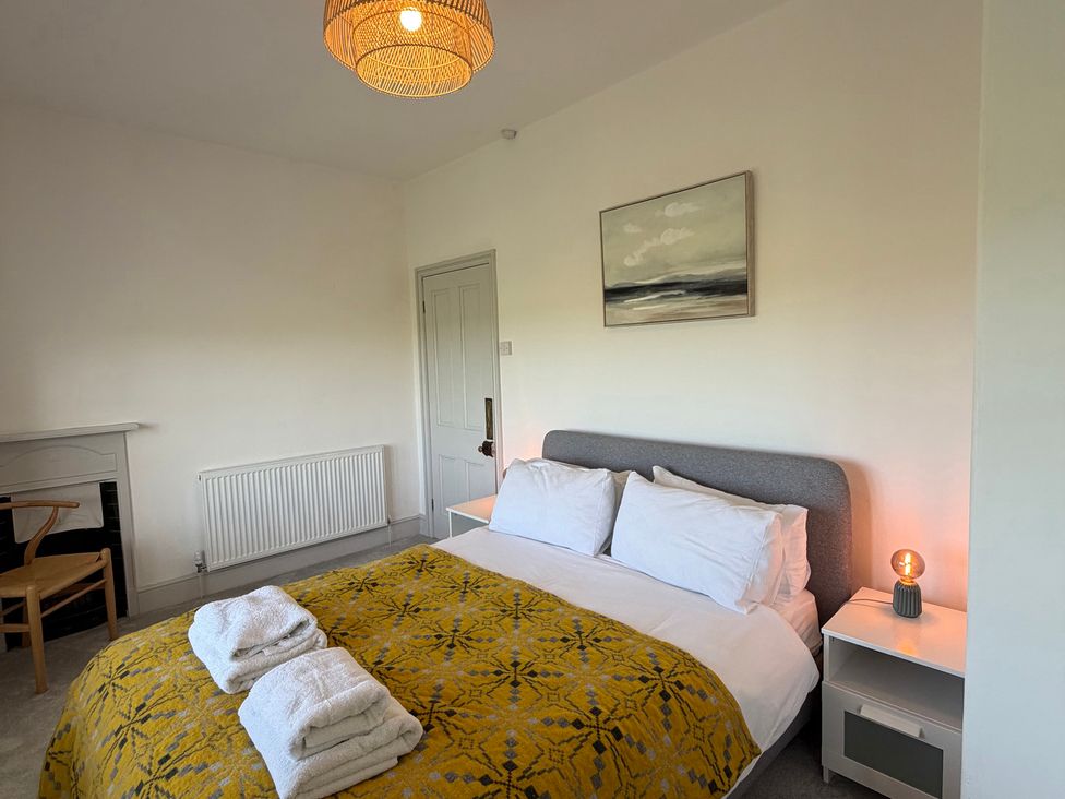 A bedroom featuring a bed with linens and pillows at Ty Mawr Farm Penmynydd near Llanfairpwllgwyngyll