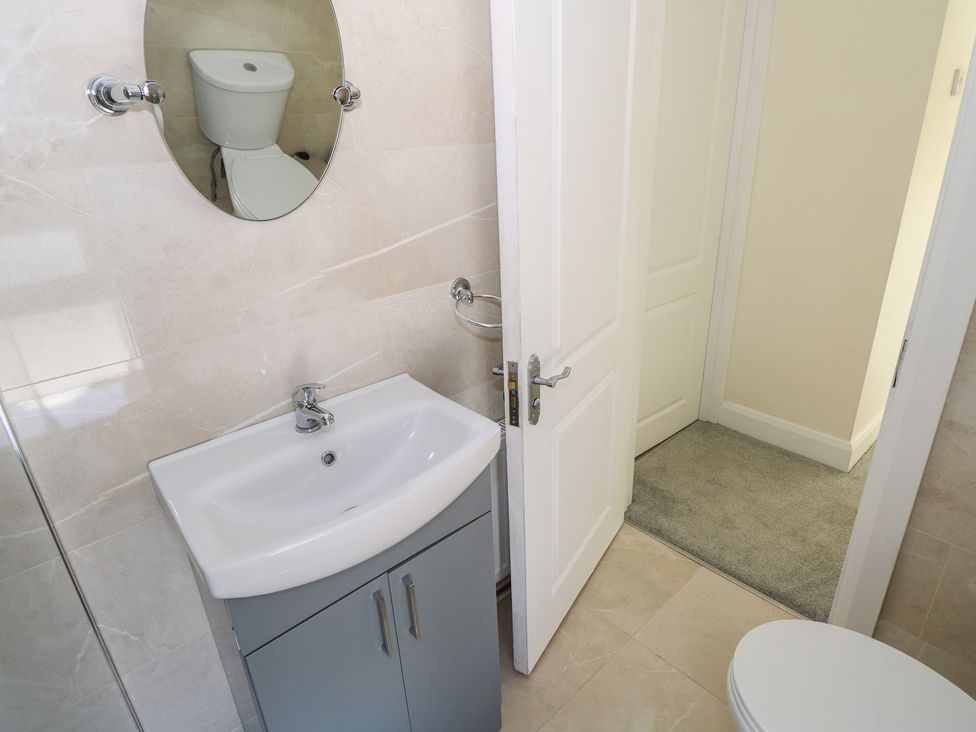 A bathroom with a sink and toilet at Greenfield House Aughavas County Leitrim
