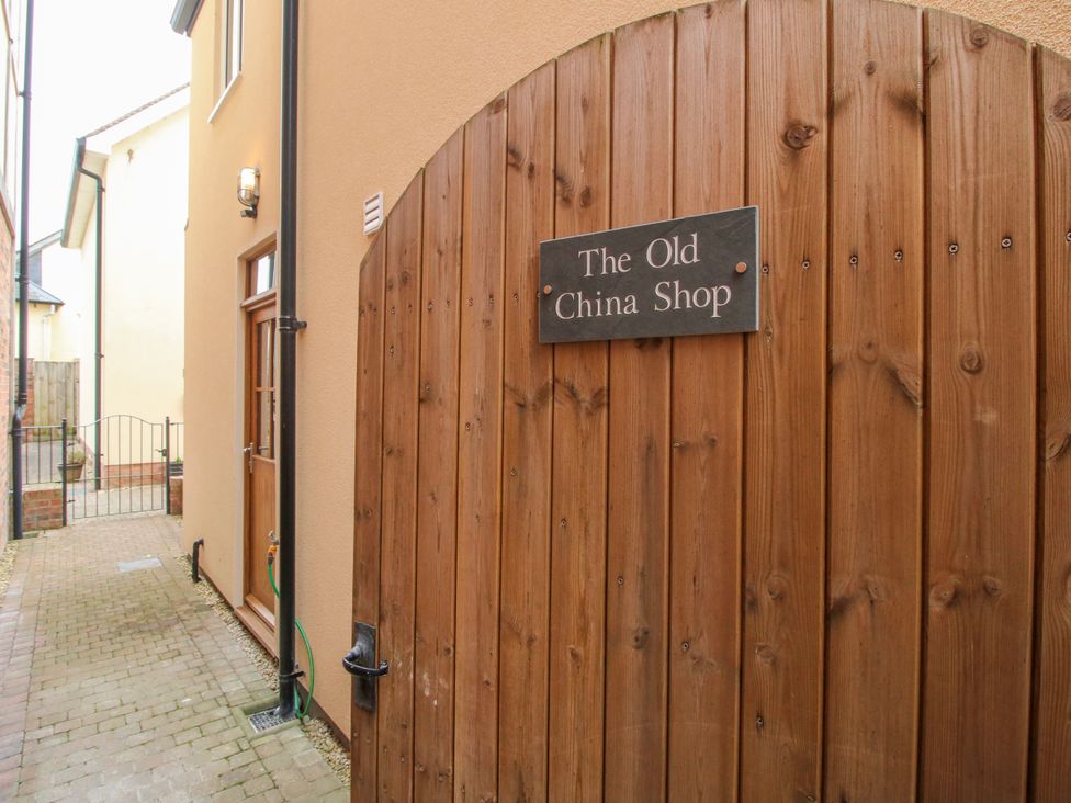 A wooden gate with a sign at The Old China Shop in Ludlow