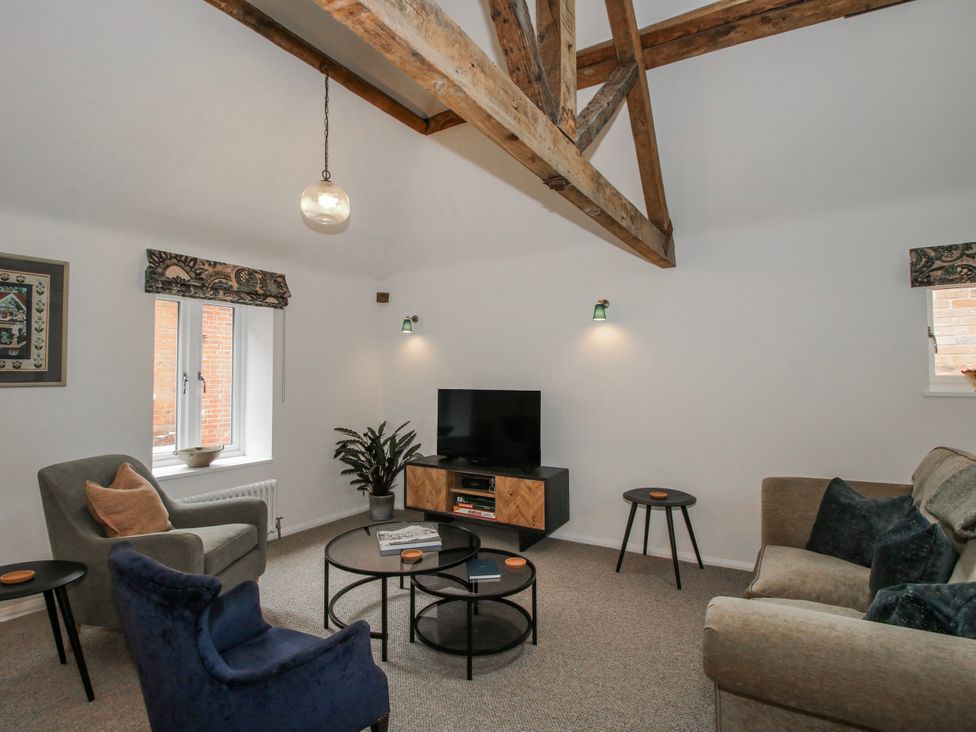 A living room with a sofa and coffee table at The Old China Shop in Ludlow