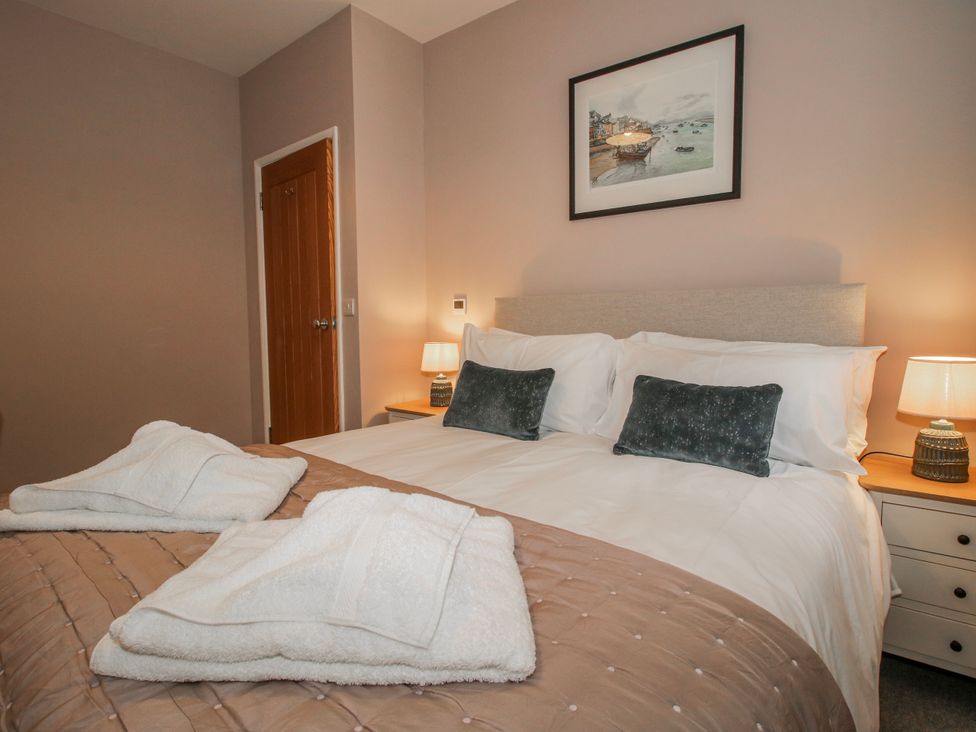 A bedroom with a double bed and bedside lamps at The Old China Shop in Ludlow
