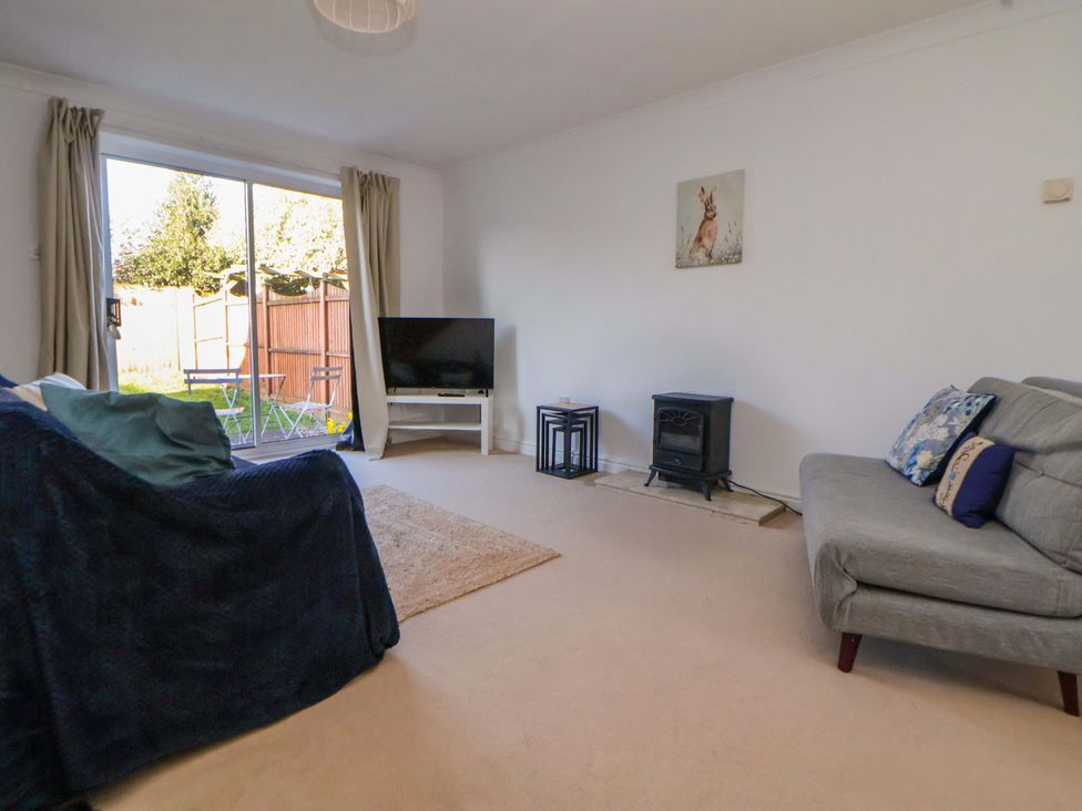 A living room with a tv and a sofa at 10 Church Walks in Chester