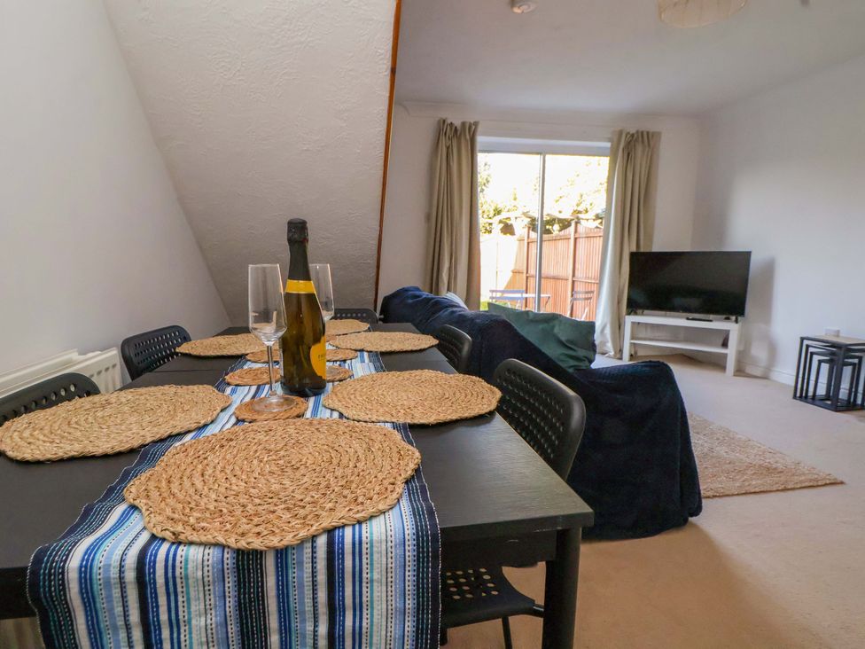 A dining area with a table set for drinks at 10 Church Walks Chester