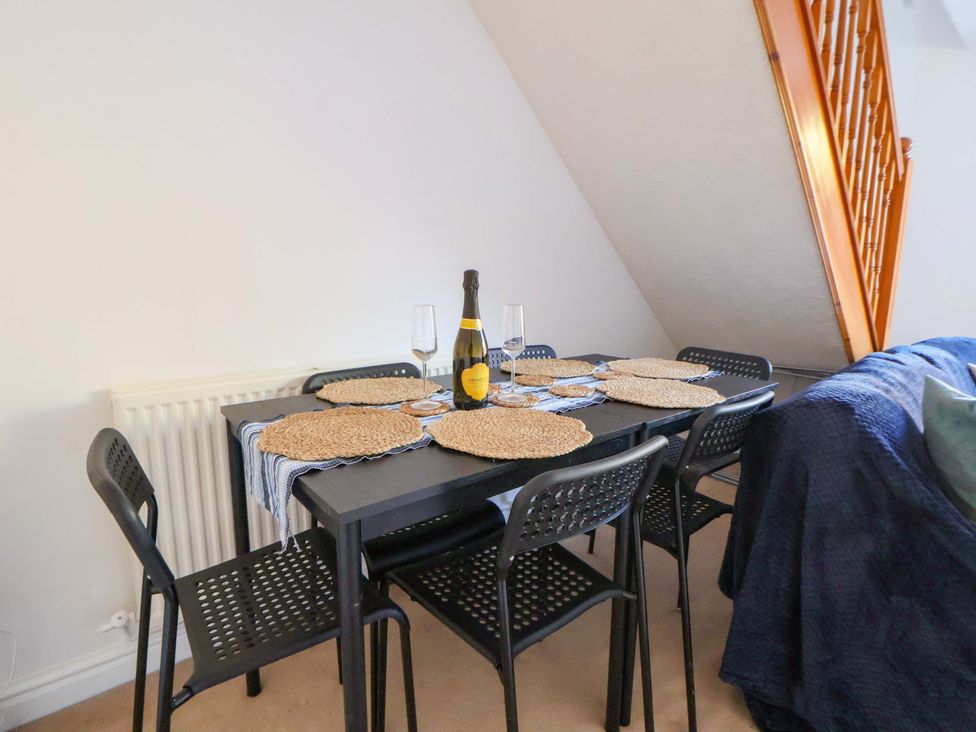 A dining table with wine and glasses at 10 Church Walks Chester